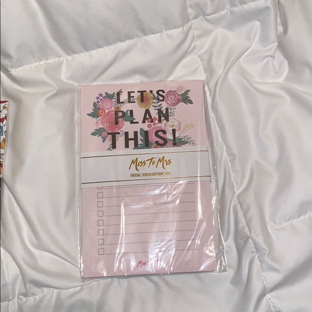 Wedding planning pad and paper clips